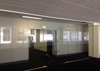 Glass wall and doors installed in office.