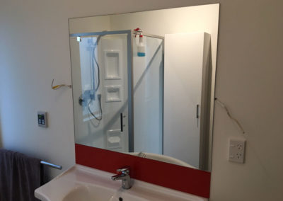 Glass Mirror installed in renovated bathroom.